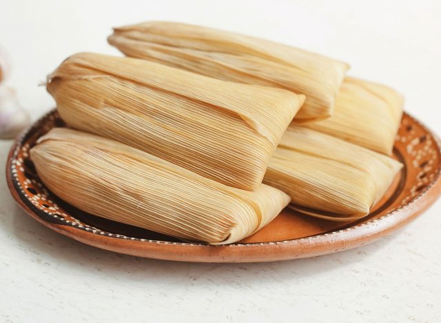 tamales piled on a plate