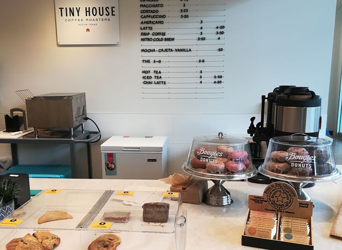tiny house coffee roasters counter with pastries and sign