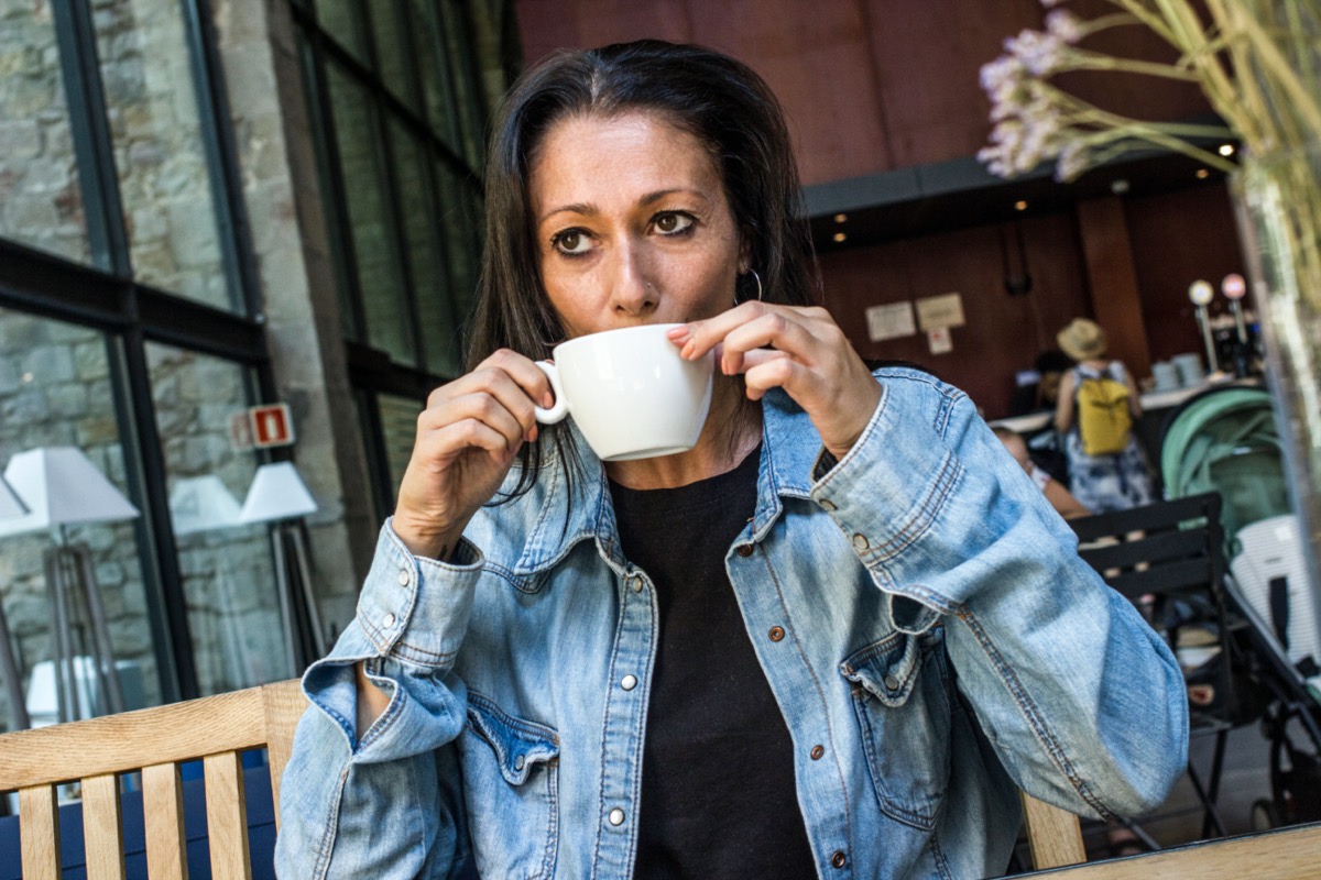 Stressed woman drinking coffee