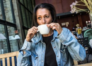 Stressed woman drinking coffee