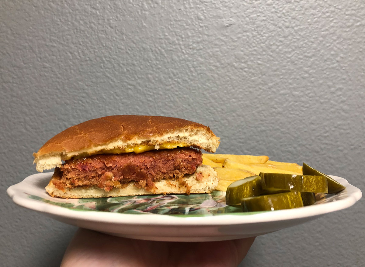cooked trader joe's plant-based patty with fries and pickles