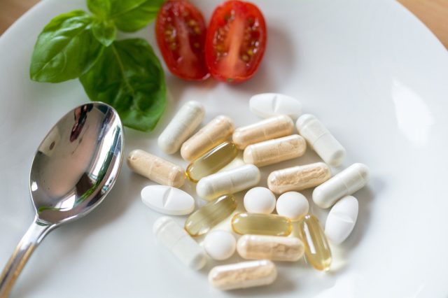 Dietary supplements, vitamins, plate