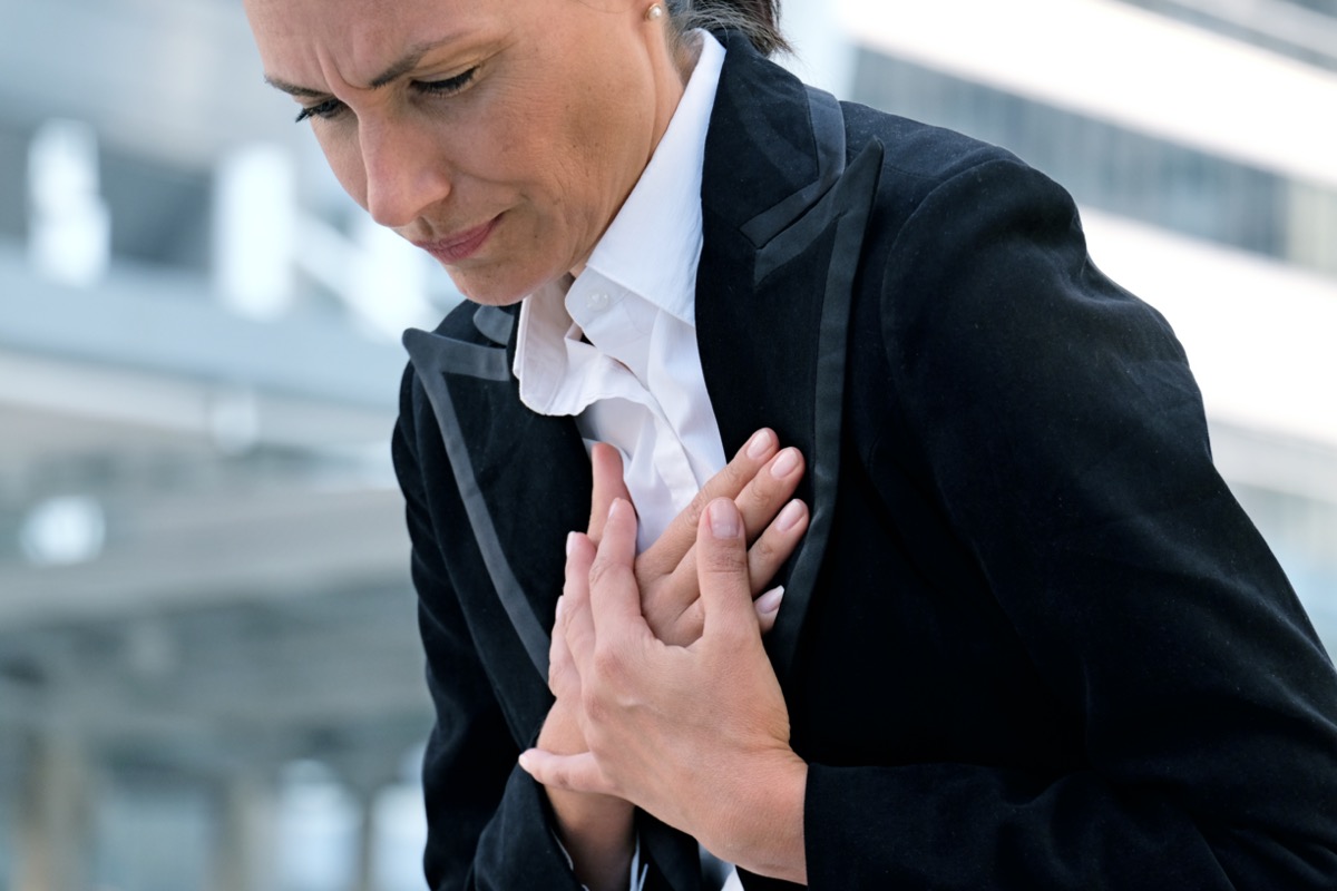 Woman chest pain heart attack outdoor