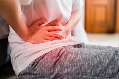 woman having painful on her stomachache or pelvic pain