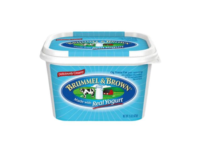 blue tub of butter substitute on a white background