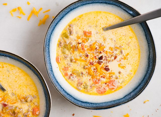 cheeseburger soup topped with cheese and bacon