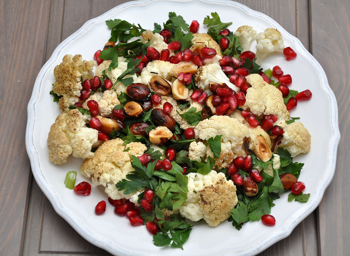 Vegetable salad with cauliflower, hazelnuts, and pomegranate seeds