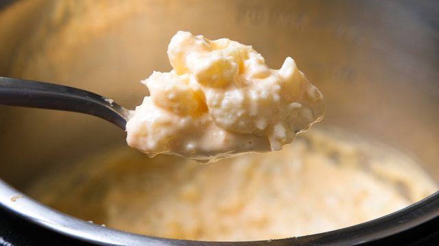 scoop of cheesy cauliflower mac and cheese from an instant pot