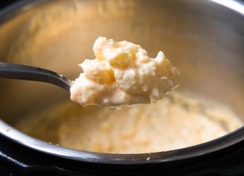 scoop of cheesy cauliflower mac and cheese from an instant pot