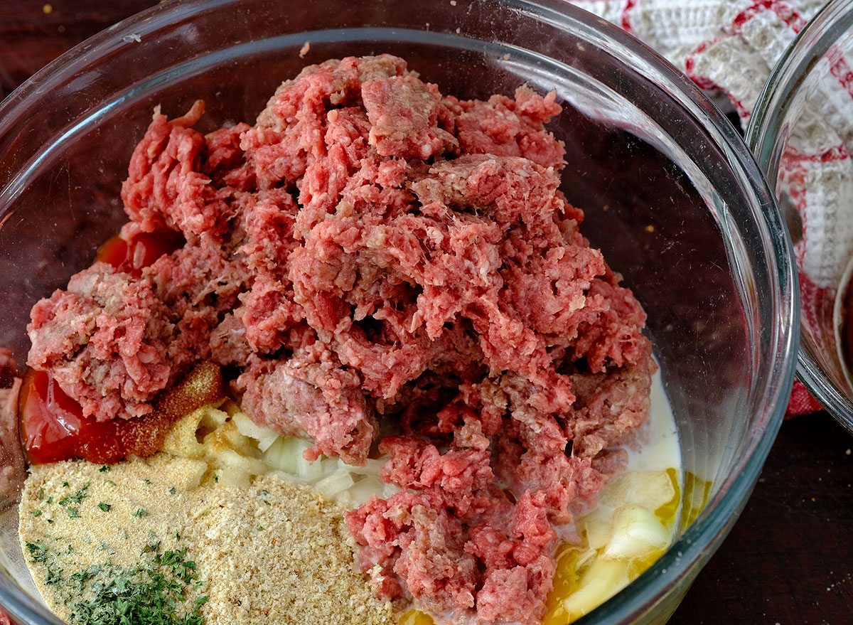 raw meatloaf ingredients in mixing bowl