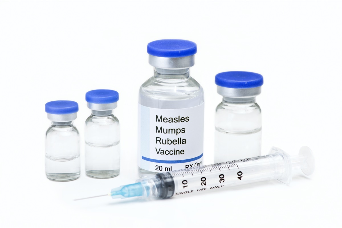 Measles, mumps, rubella, virus vaccine vials and syringe.