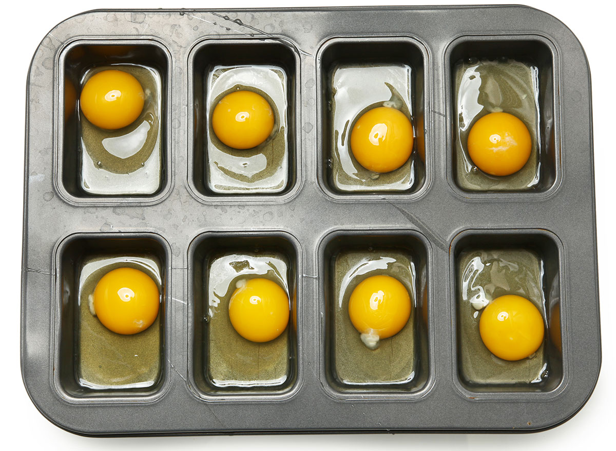 raw eggs in muffin tin for baking