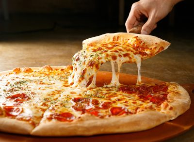 cheese pizza on wooden board