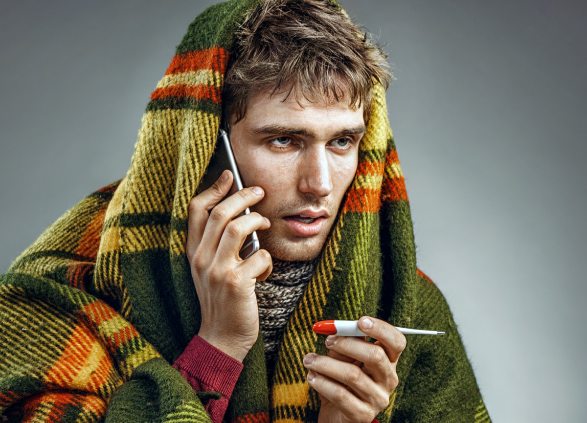 Sick cold man call phone illness flu thermometer