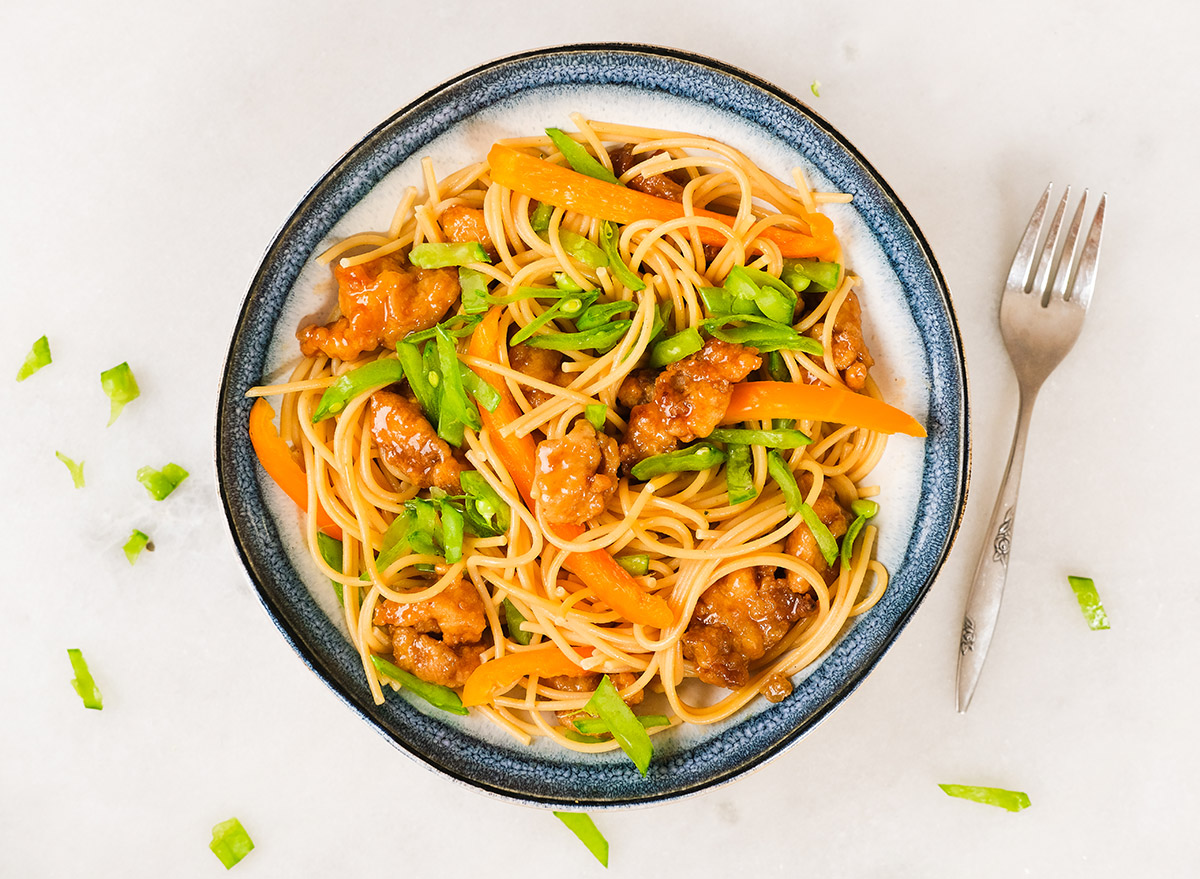 orange chicken pasta with fresh vegetables