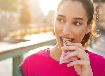 Woman eating meal replacement bars