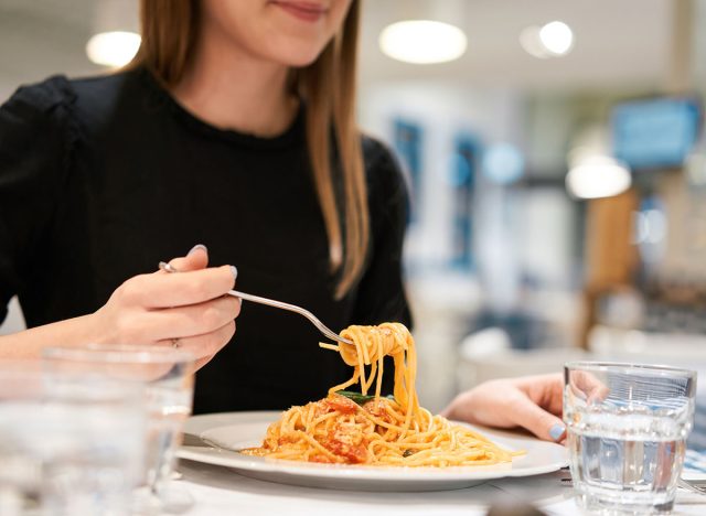 woman eating pasta