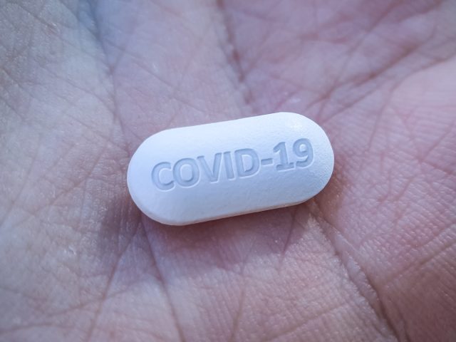 Concept of antiviral drug medication in hand for new COVID19 Coronavirus