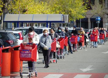Coronavirus pandemic effects: long queue to enter the supermarket for grocery shopping