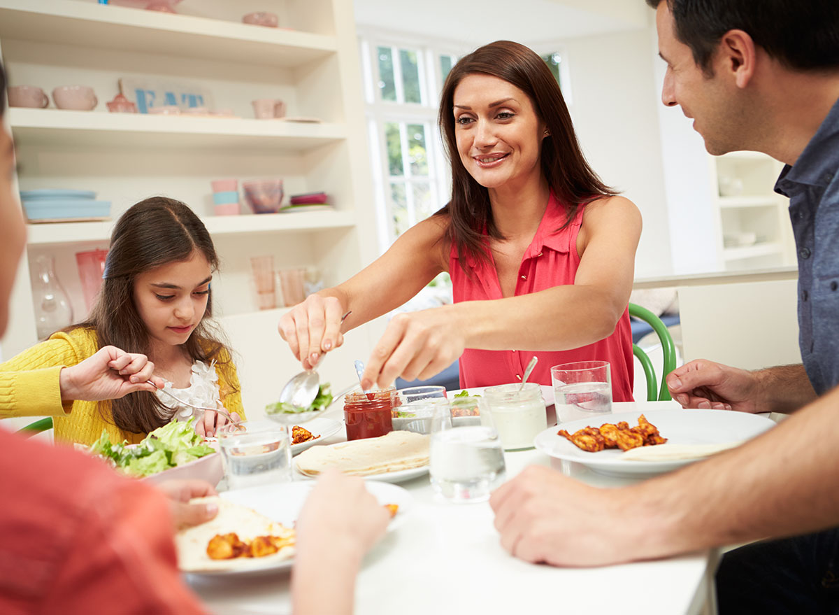 family of four eating dinner