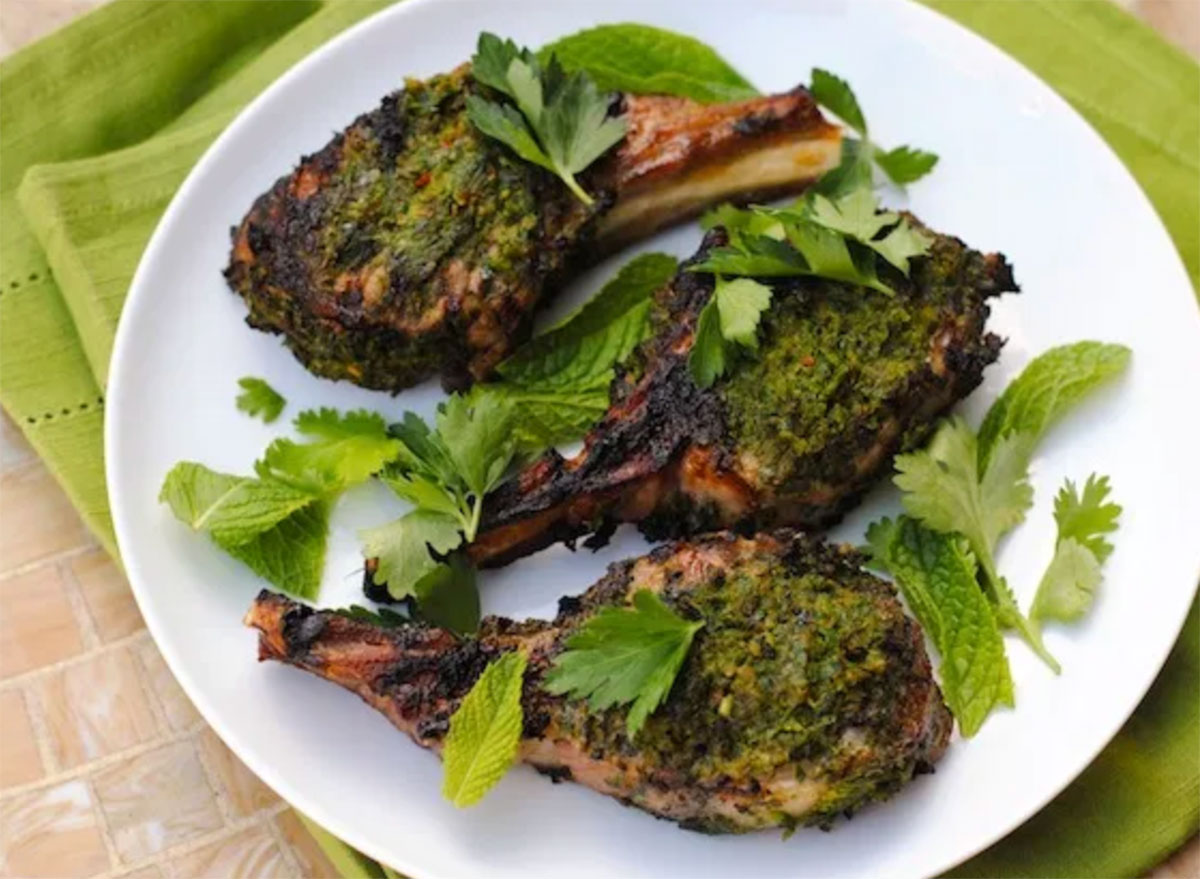 herb crusted grilled lamb chops on white plate