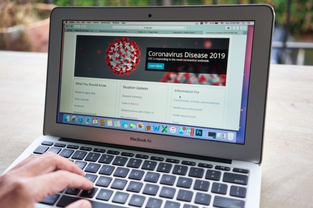 A man browsing the CDC website to learn key facts about the Coronavirus Disease 2019