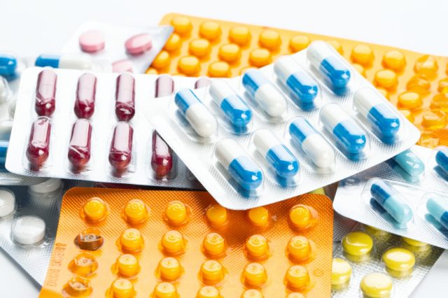 multi-colored blisters with pills.  drug treatment of various diseases.  place for text