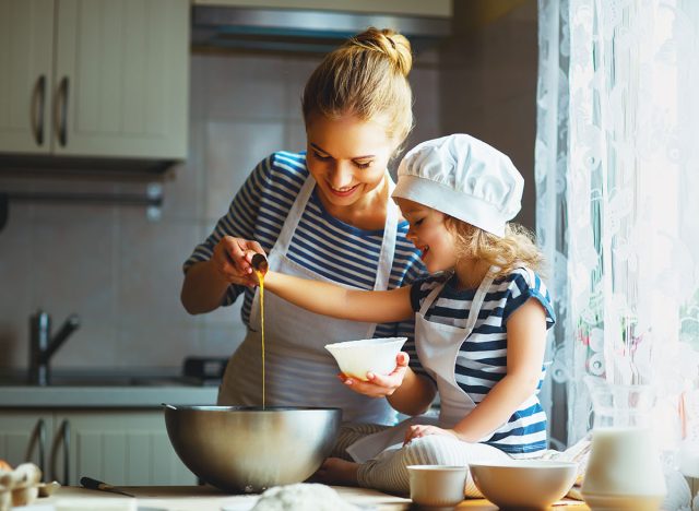 Mother and daughter baking together