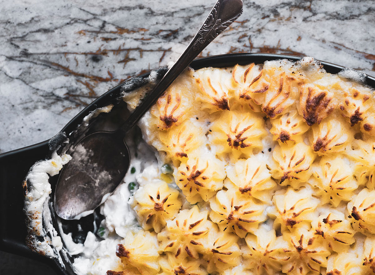 fish pie in baking dish with spoon