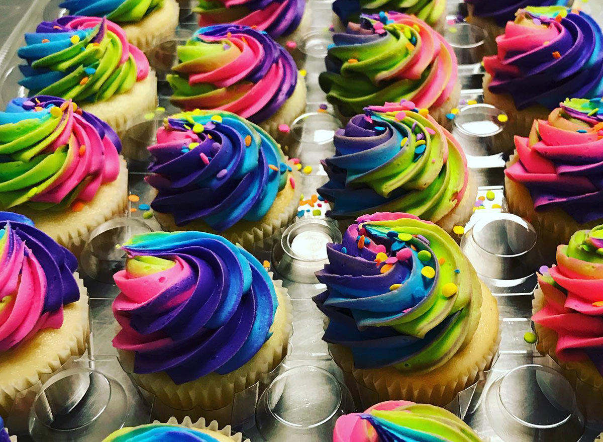 cupcakes decorated with rainbow frosting