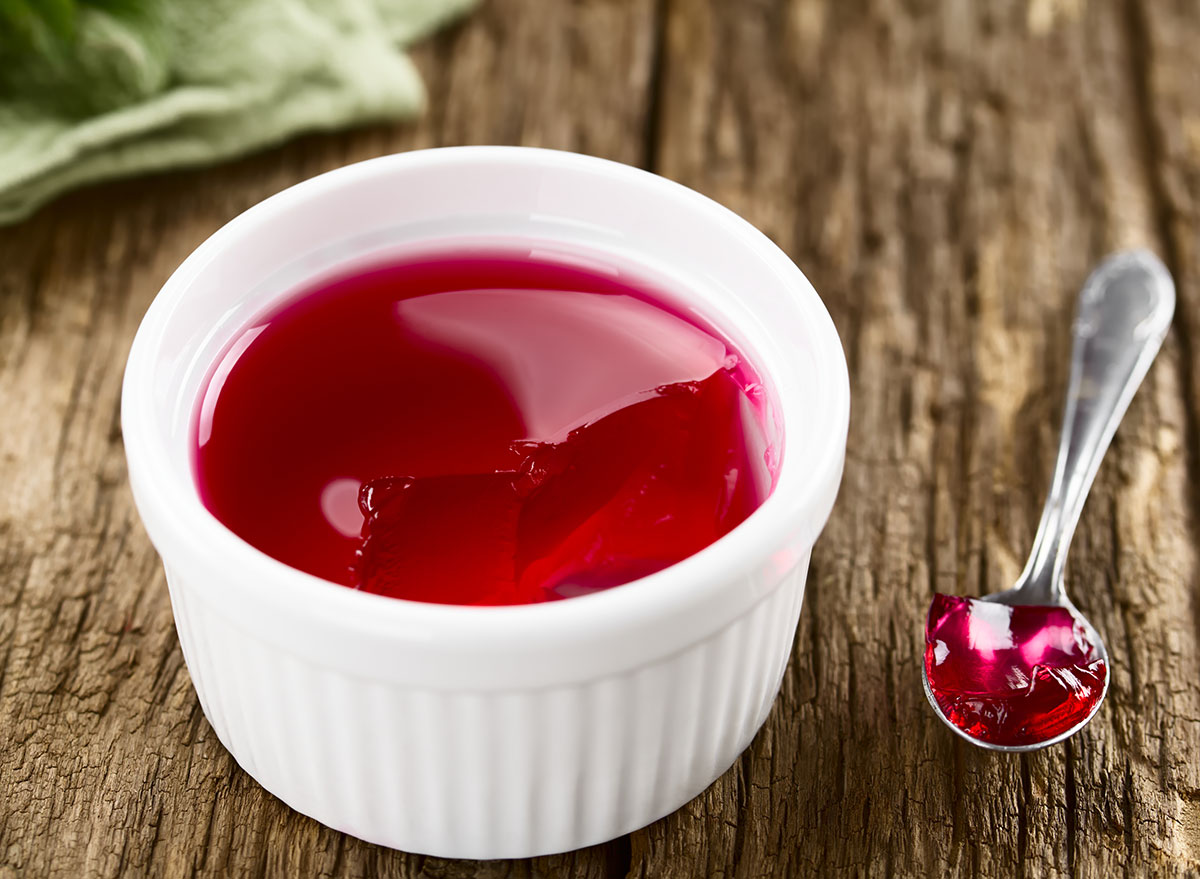 bowl of red gelatin with spoon