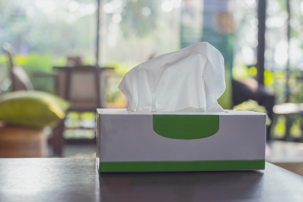 Tissue box on wooden table at home. Tissue paper for cleaning