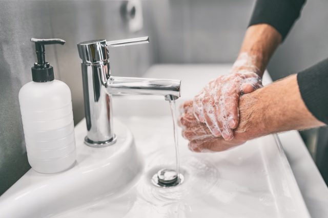 Washing hands rubbing with soap man for corona virus prevention, hygiene to stop spreading coronavirus.