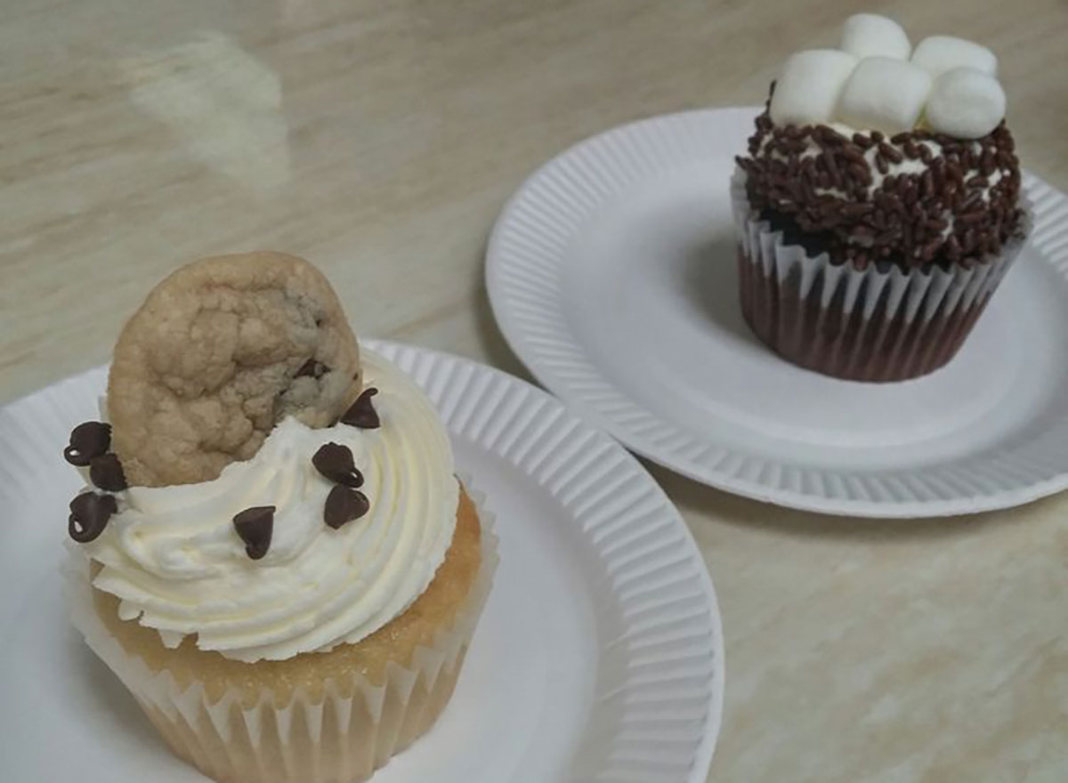 cookie dough and hot chocolate cupcakes on paper plates