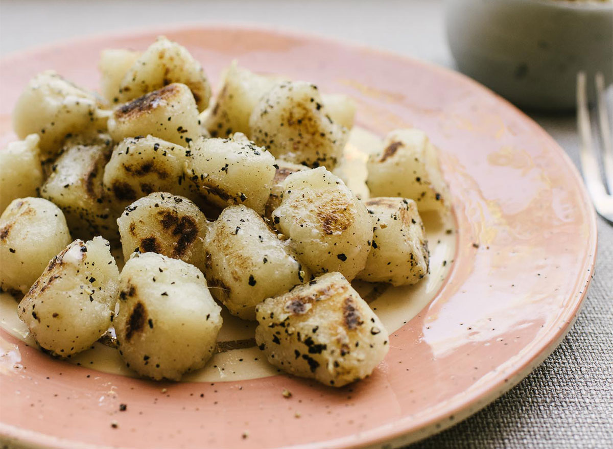 cacio e pepe cauliflower gnocchi on plate