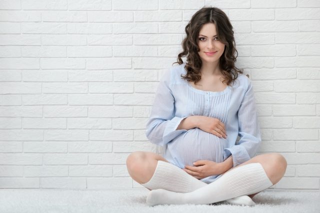 Portrait of the young pregnant woman