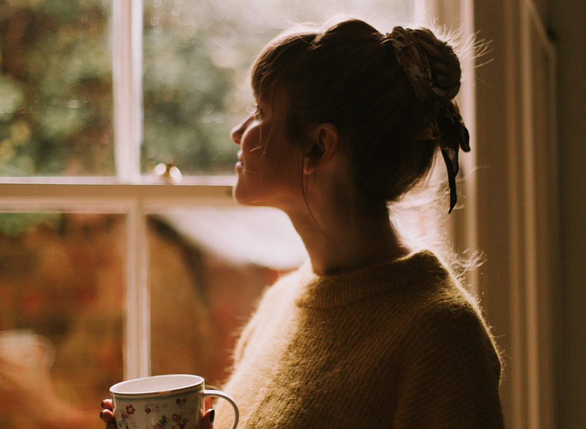 healthy gal sitting by the window