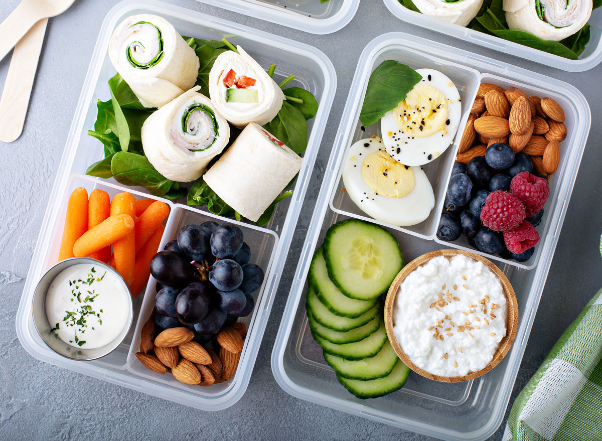 high protein snack or lunch box with cottage cheese cucumbers almonds berries hard boiled egg turkey wraps carrots and ranch