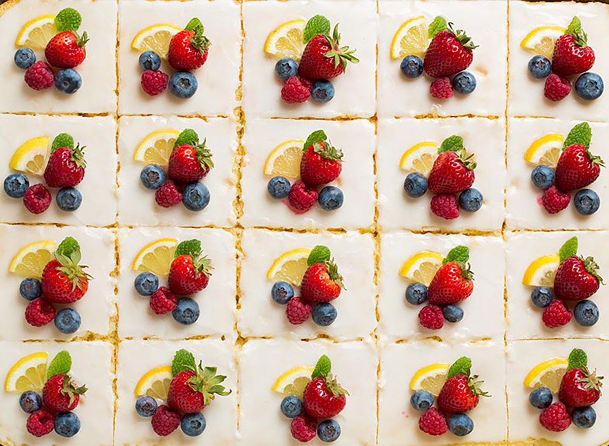 slices of lemon sheet cake topped with fresh fruit