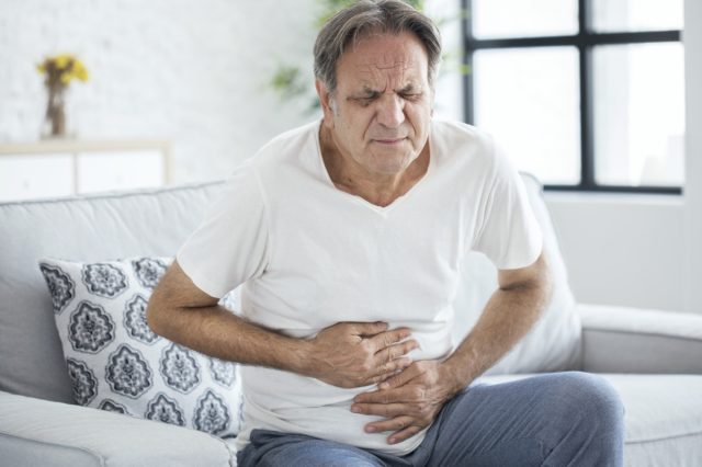 Senior man with stomach pain