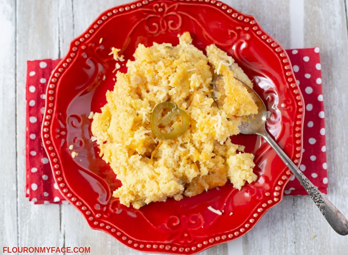 corn spoon bread on red plate