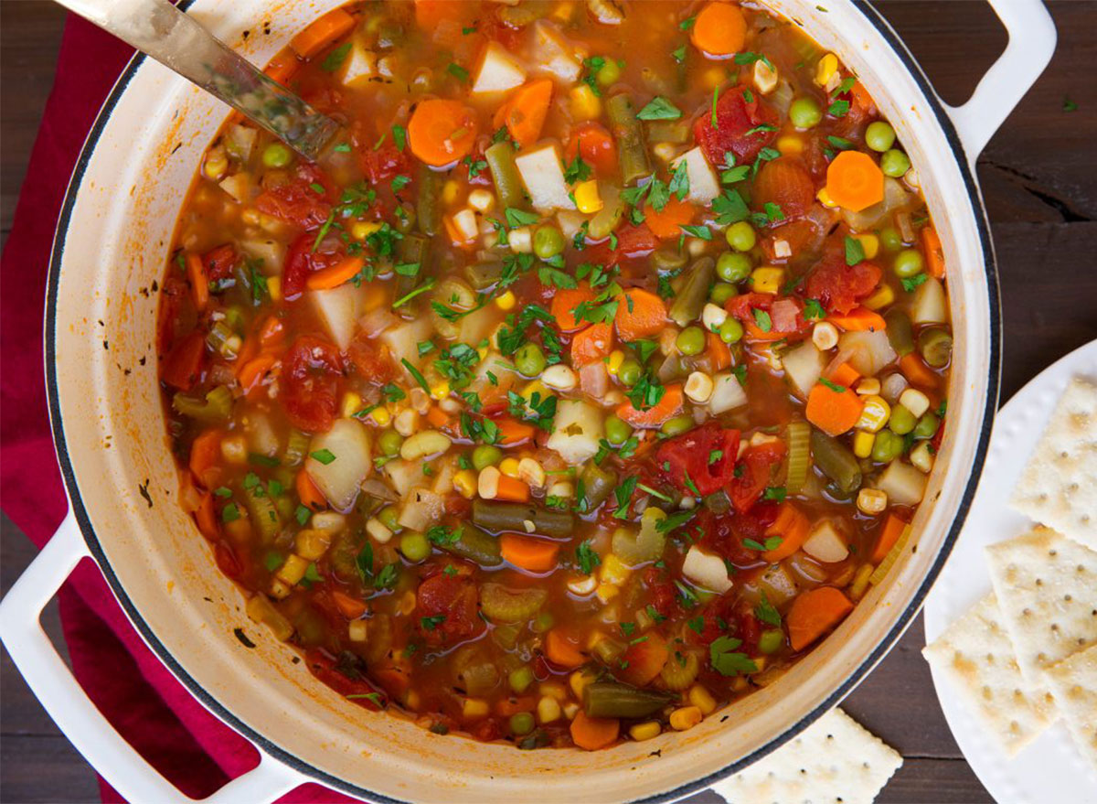 pot of vegetable soup with saltines
