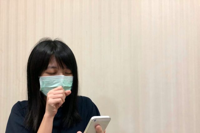 Asian female model wearing green surgical face mask