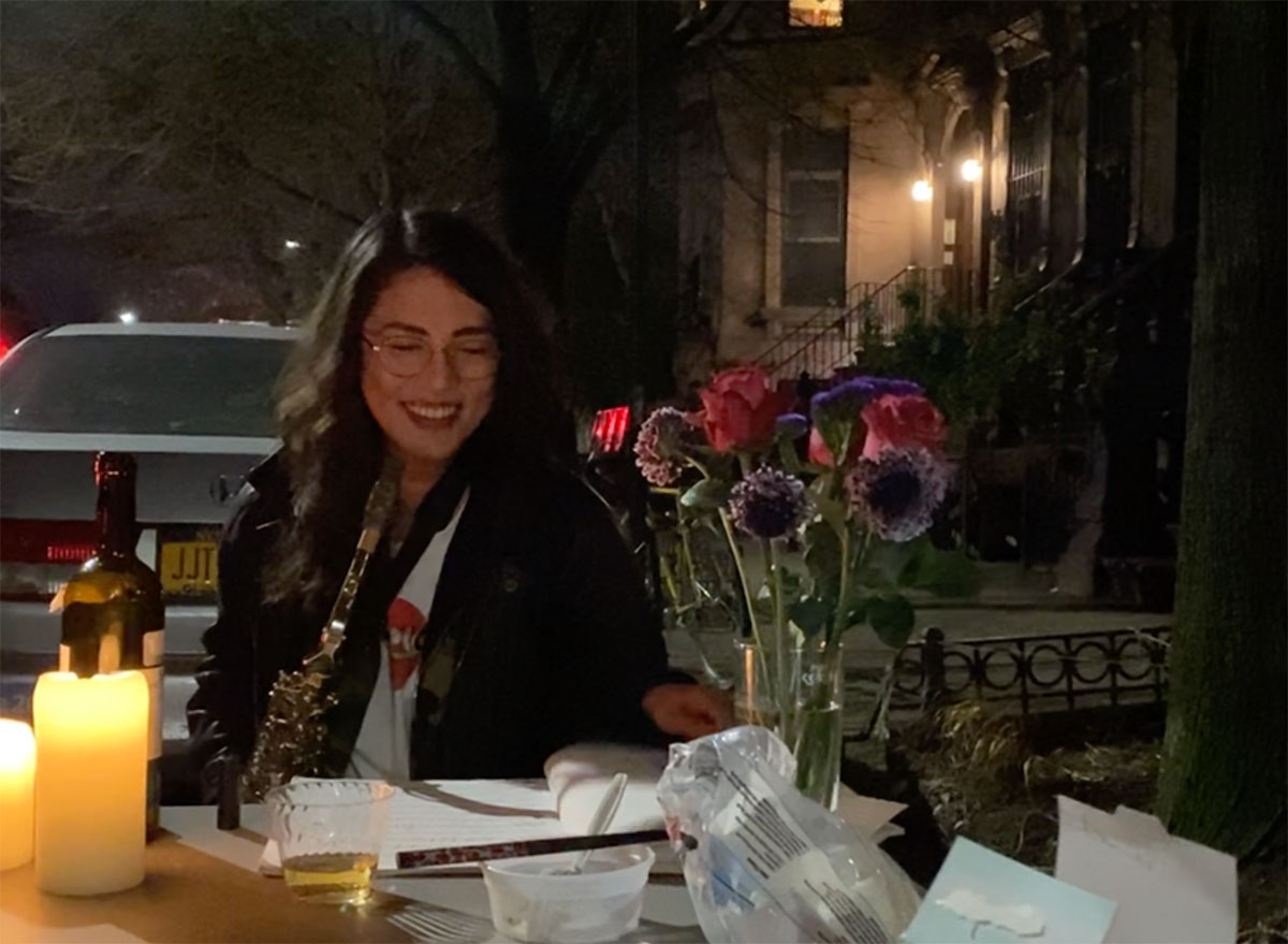 woman eating on street