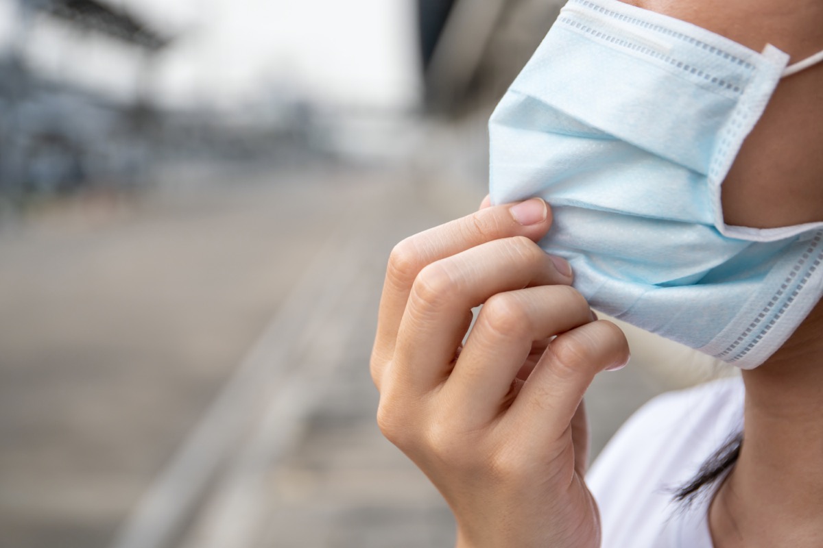 woman wearing a hygiene protective mask to protect her self from coronavirus disease