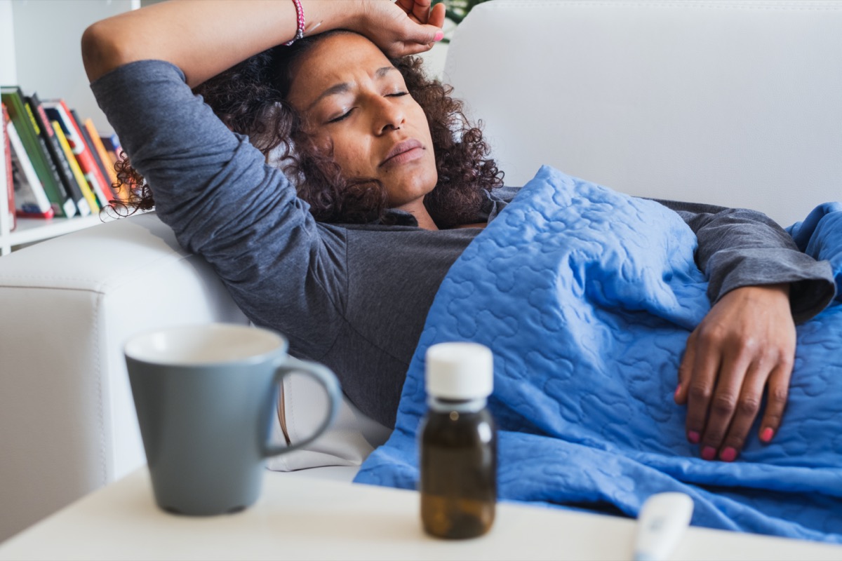woman feeling sick and seasonal flu symptoms