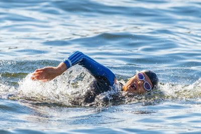 Face of a female triathlete swimming