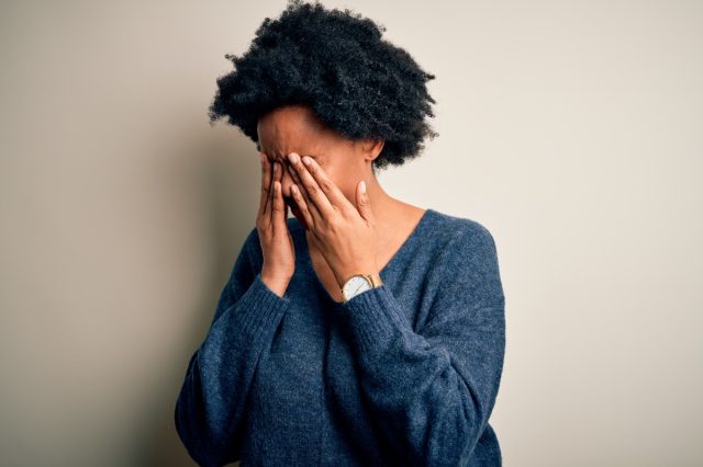 African American afro woman with curly hair wearing casual sweater rubbing eyes for fatigue and headache, sleepy and tired expression