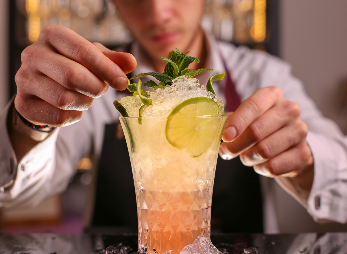 Bartender fixing up a cocktail