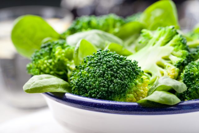 Broccoli, spinach, green bean ceramic bowl salad